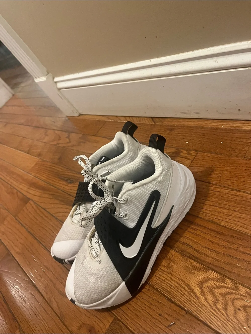 Kids White and Black Athletic Sneakers with Swoosh Detail